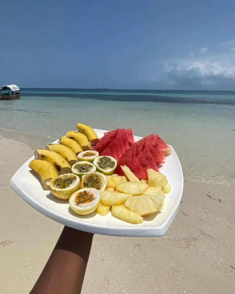 A platter of pineapple, watermelon, banana and passion fruit on the Nakupenda sandbank